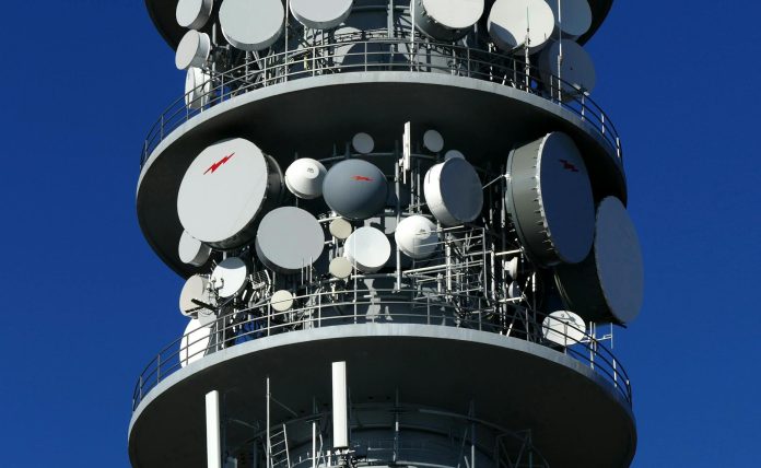 Magyar telekom-piac: tulajdonosi szerkezet — Close-up of a telecommunication tower with multiple satellite dishes in Croatia.