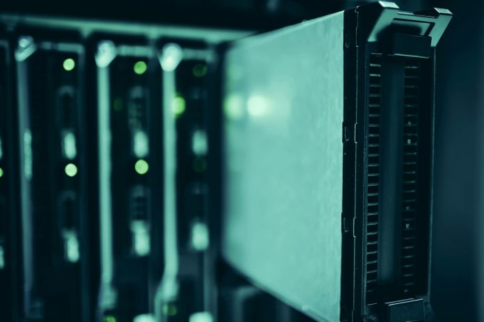 Defense-tech és állam: Forbes-listás összefüggések — Close-up of server racks in a data center highlighting modern technology infrast