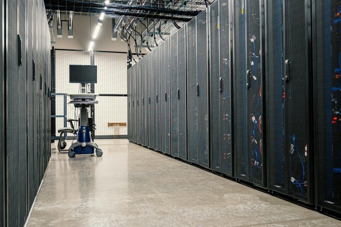 NISZ közbeszerzés: K-Monitor adatok tükrében — Steel framework cabinets housing servers networking devices and cables in contem